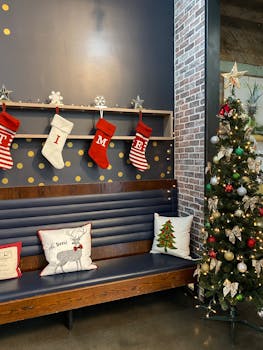 A warm indoor Christmas scene featuring stockings, decorations, and a Christmas tree.