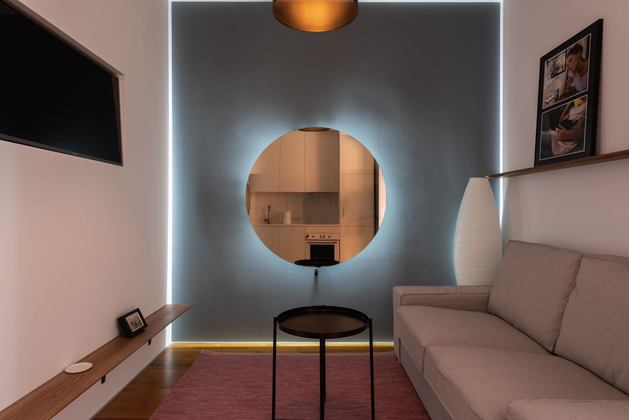 contemporary lounge with frames and comfortable sofa in front of tv se