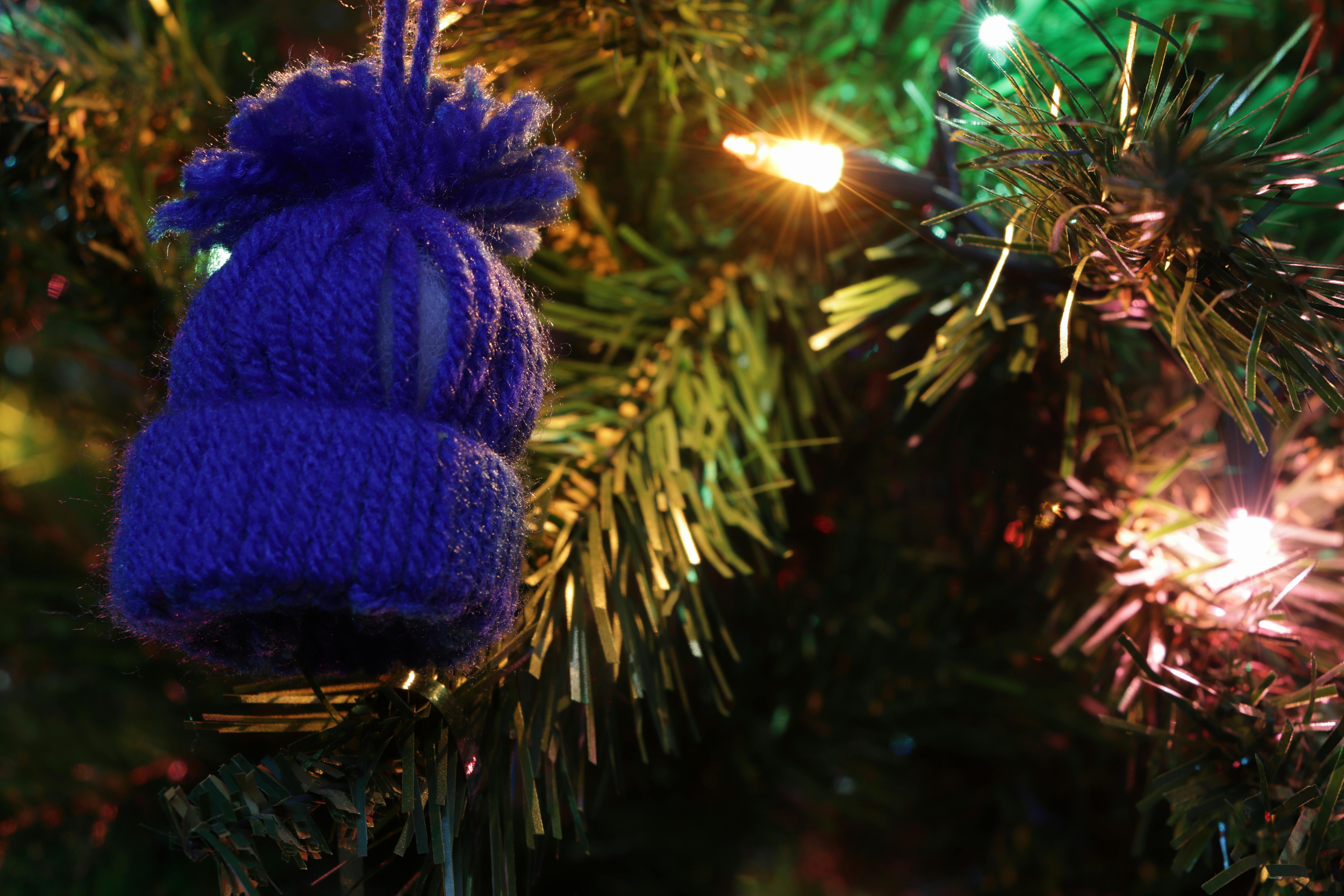 Engineer monitoring AI model training on multiple computer screens in a server room