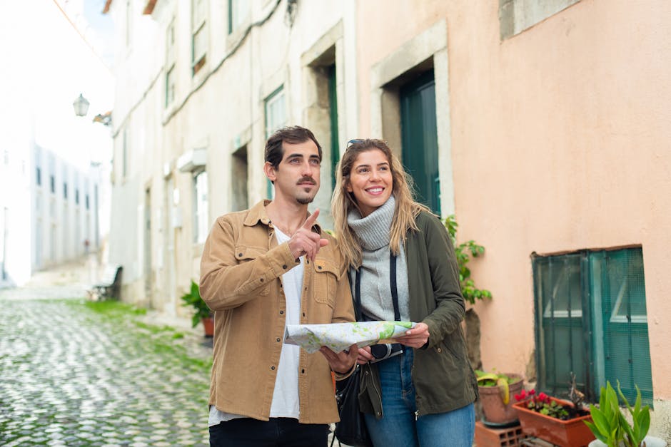 Happy couple exploring a historic city using a map, enjoying a travel adventure together.