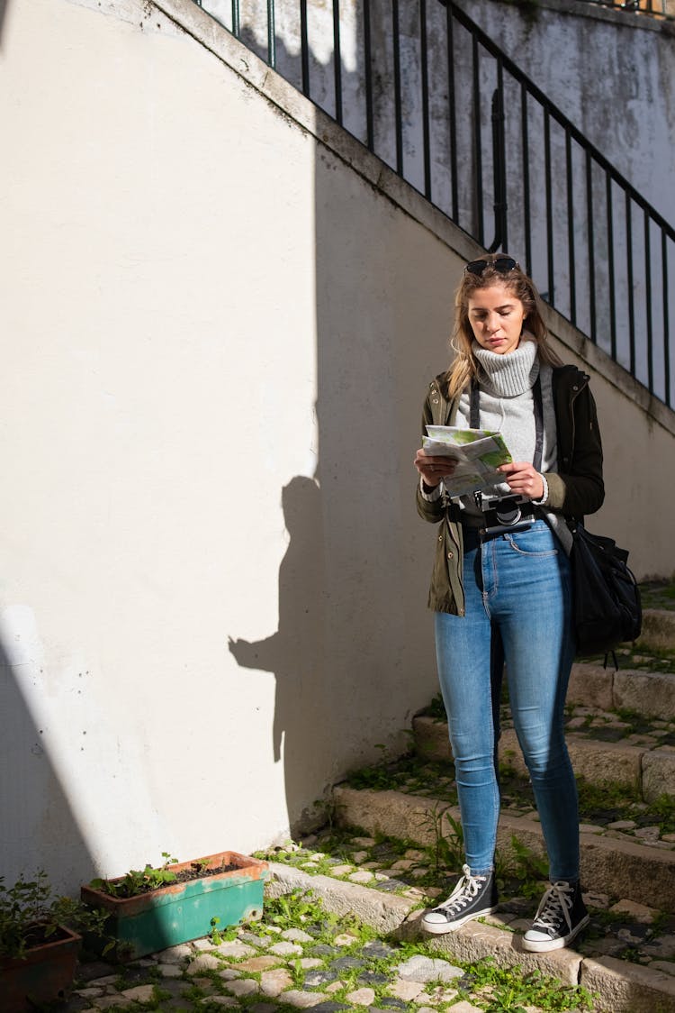 A Woman Looking At The Map