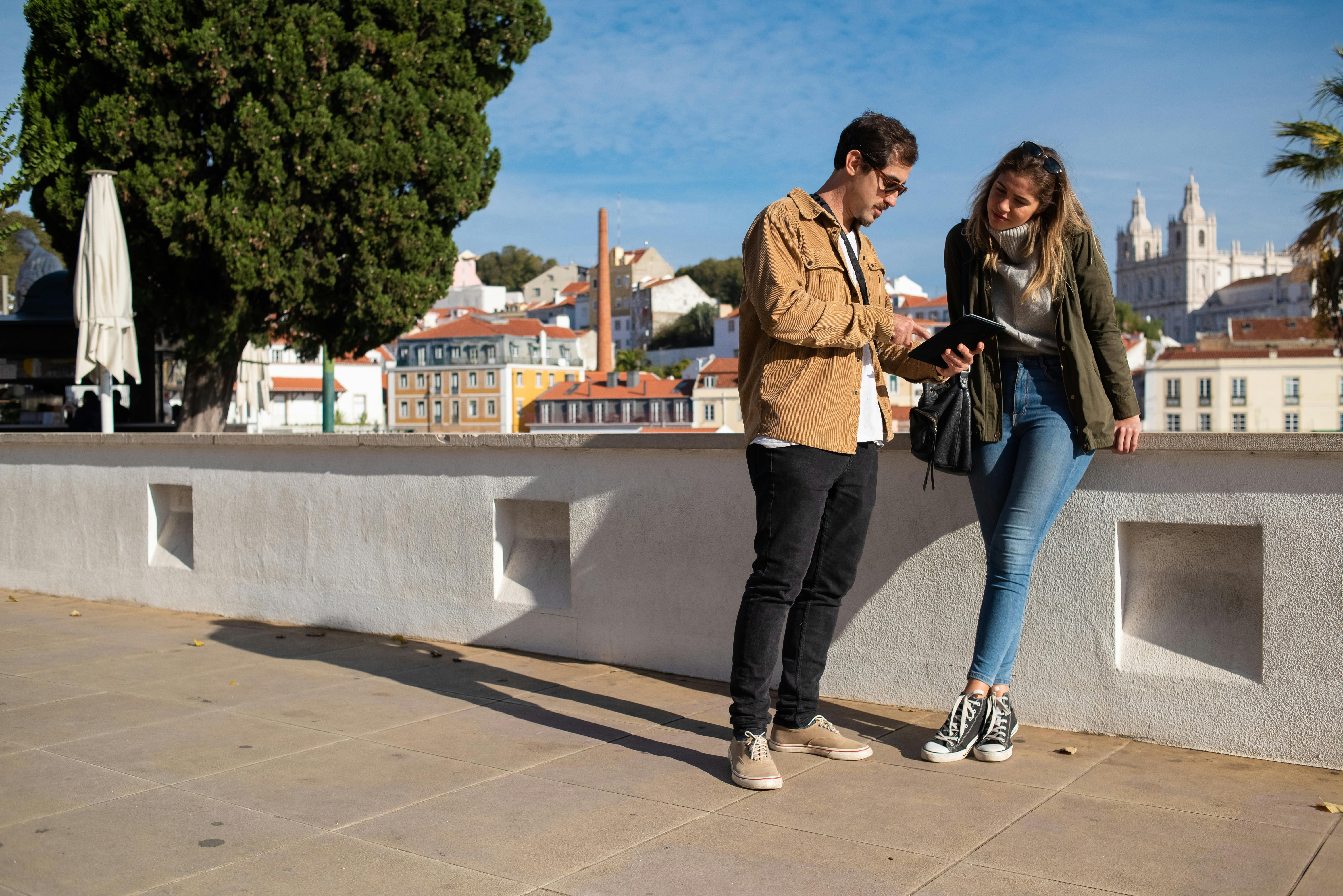 A couple standing in a city