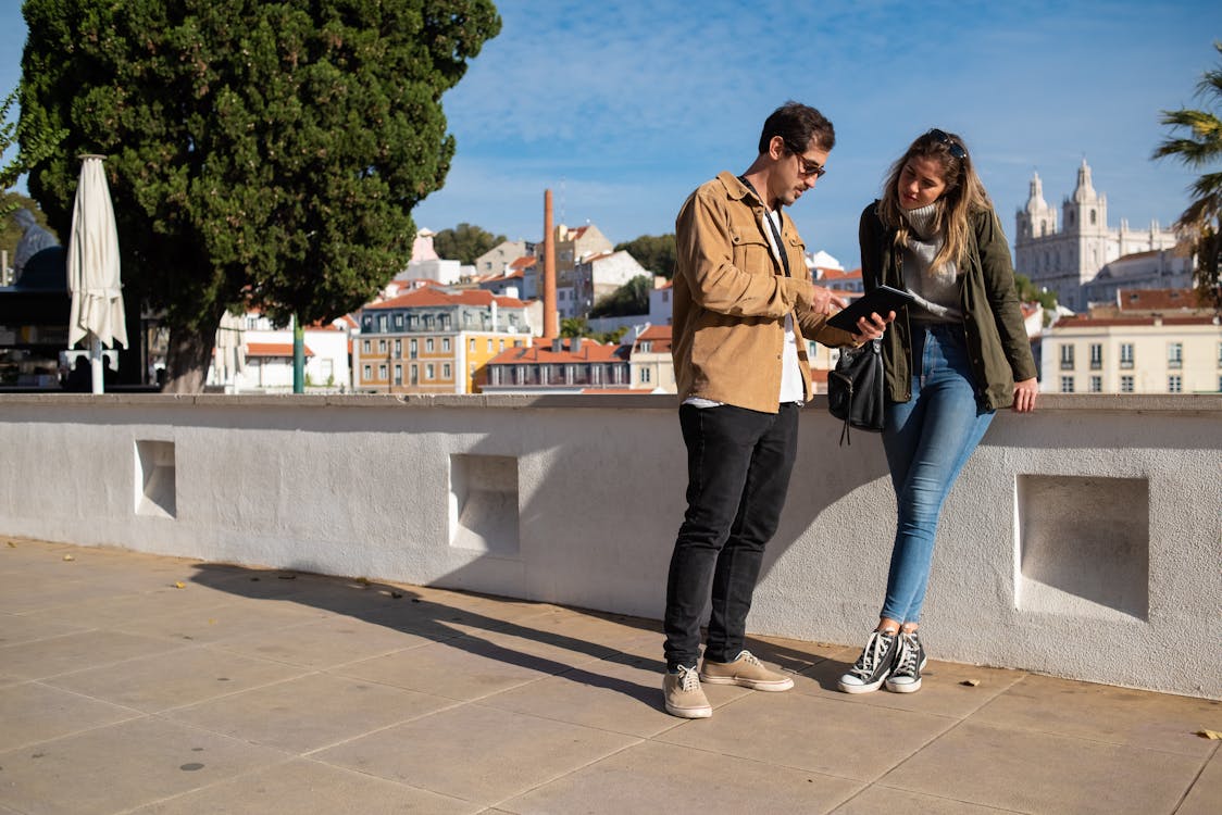 A couple standing in a city