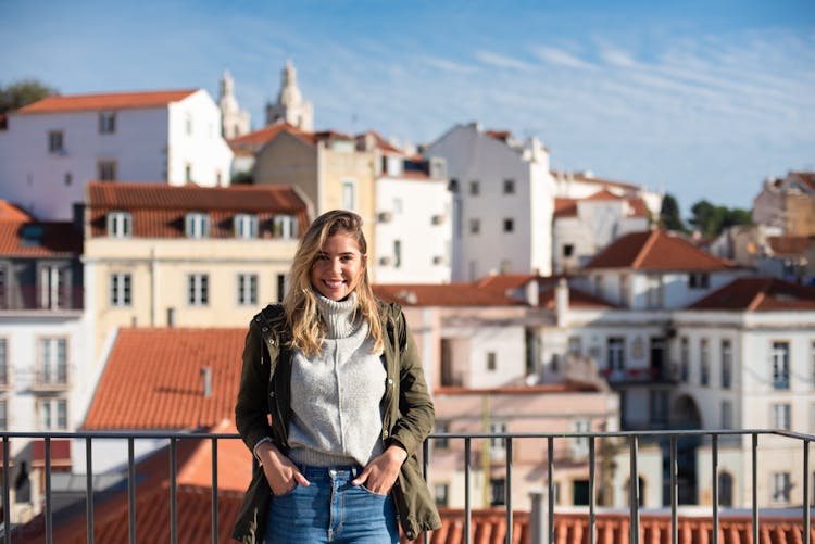 A Woman Leaning On Railing