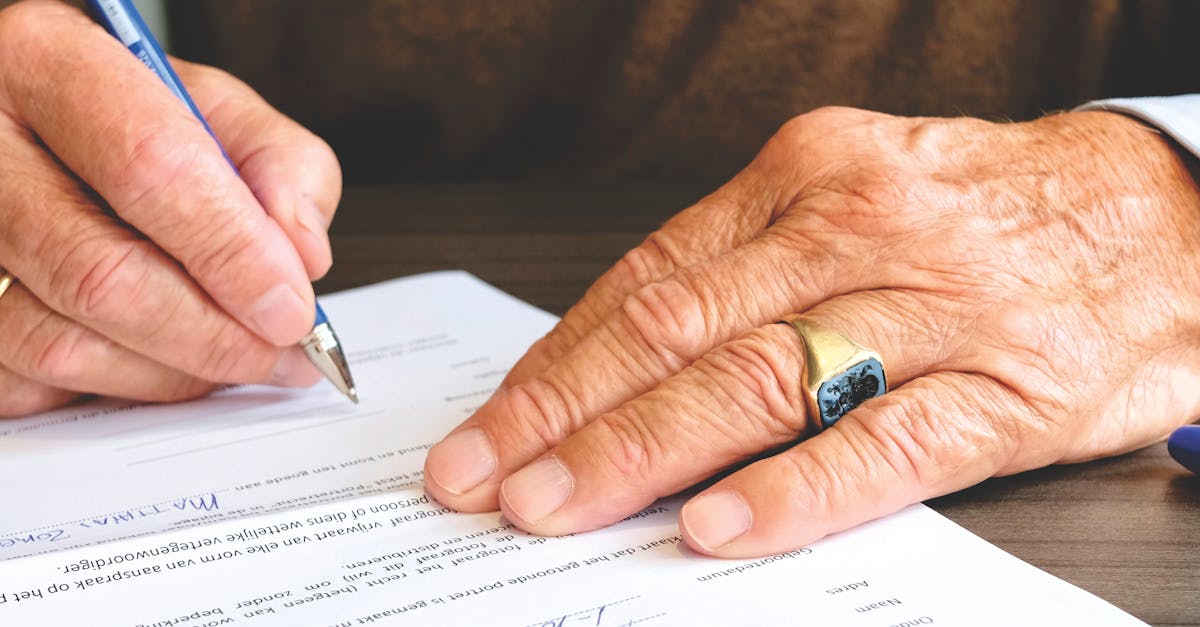 Person Signing Document Paper