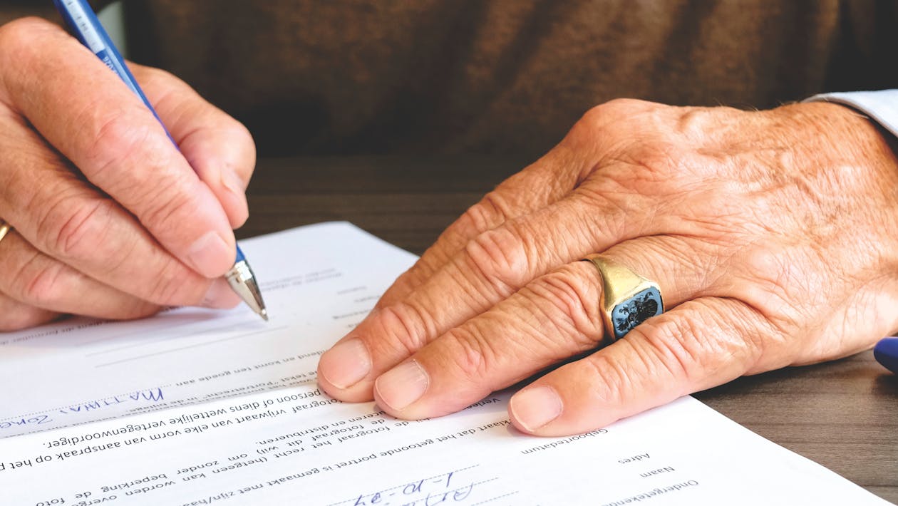 Person Signing Document Paper millionaire