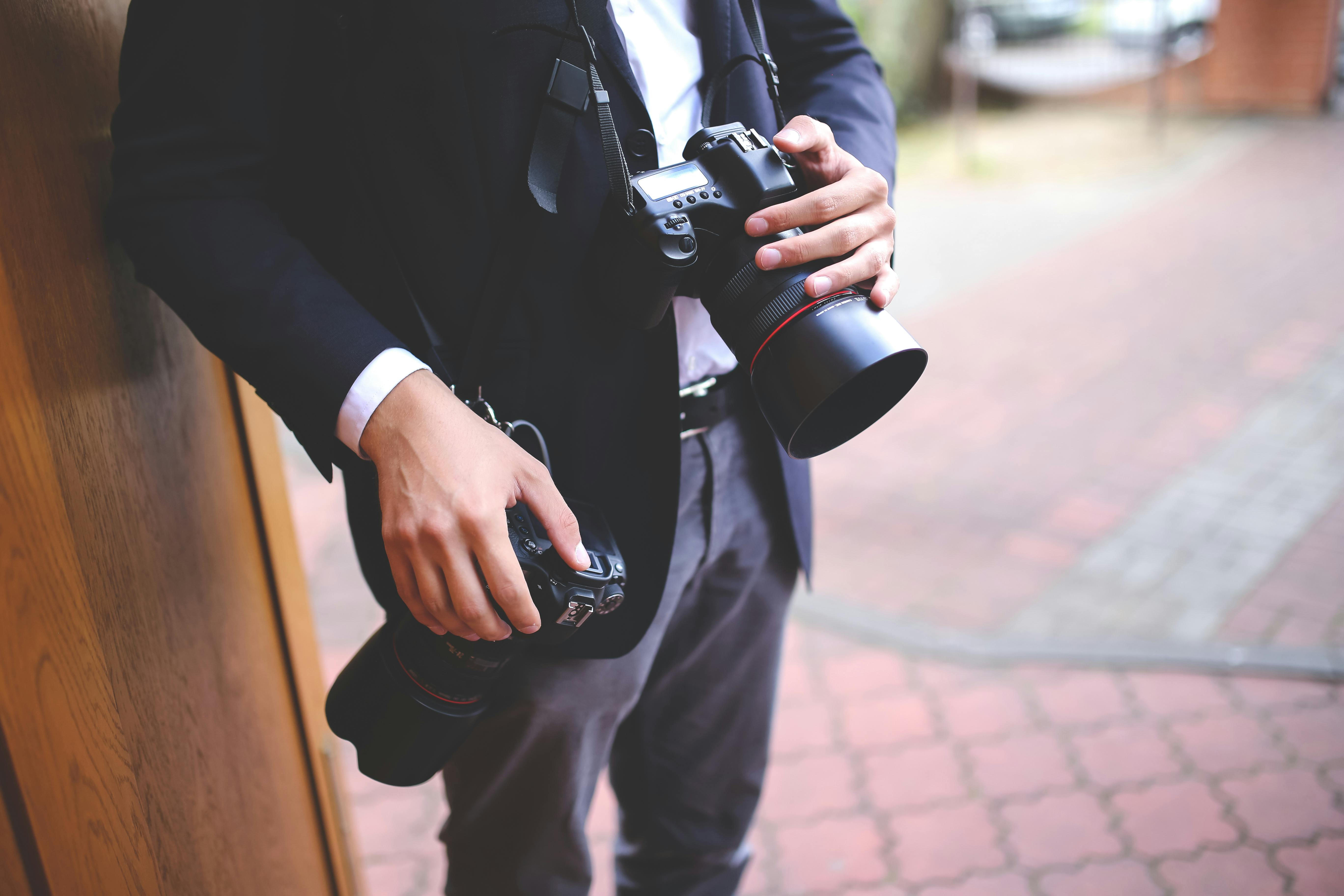 Photographer with two cameras \u00b7 Free Stock Photo