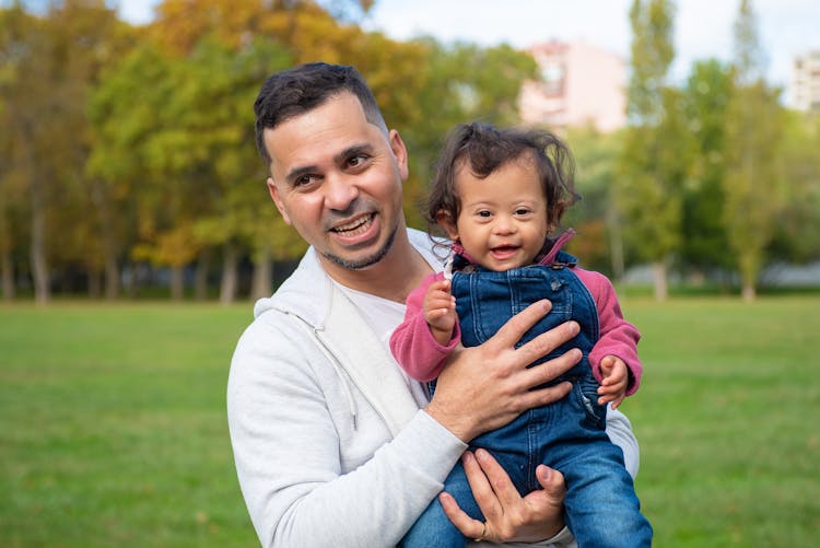 A Man Carrying His Child 