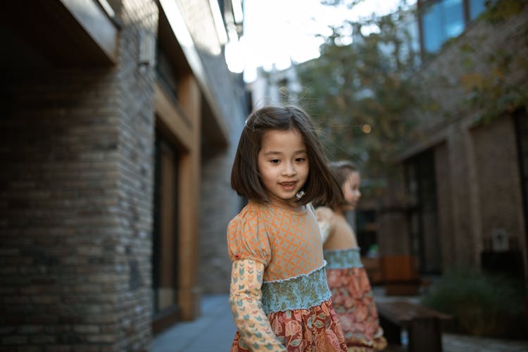 A Young Girl Wearing Dress 