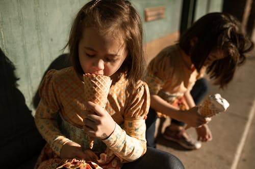 Girls Eating Ice Cream Cones