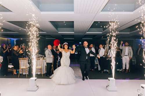 Bride and Groom Dancing on White Floor Tiles