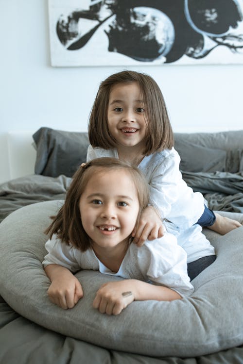 Close-up Photo of Happy Siblings 