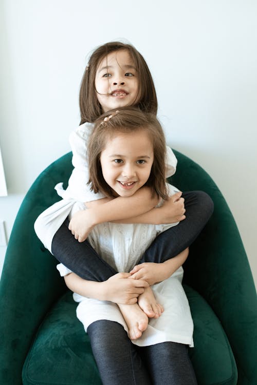 Free Smiling Girls Cuddles Stock Photo