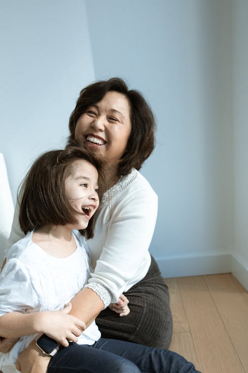 Free Woman and Her Child Cuddles Stock Photo