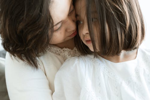 A Girl Looking at the Woman at her Back 