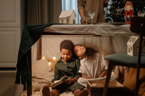 Kids Sitting Under the Table