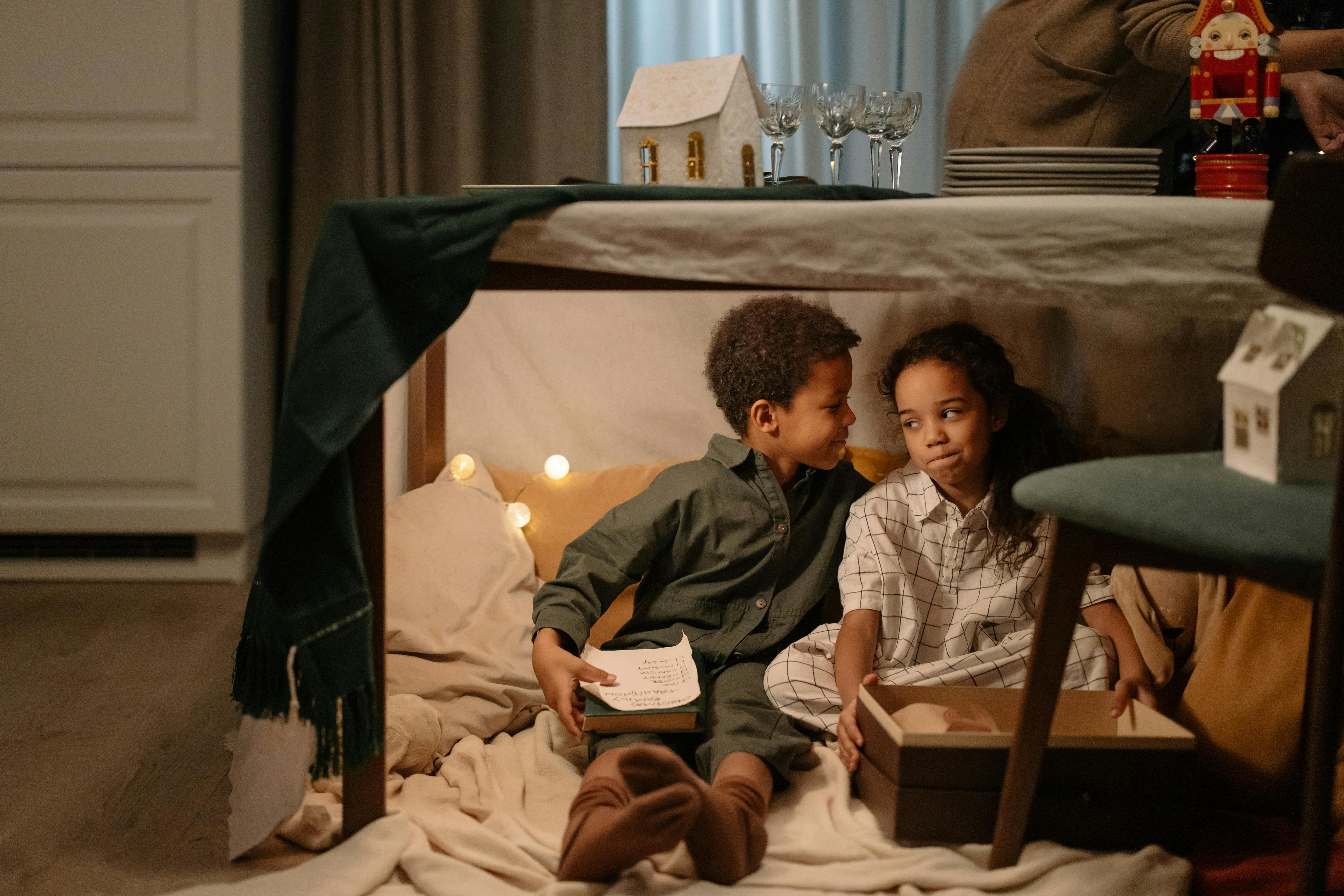 kids sitting under the table