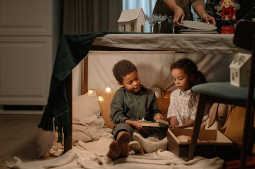 Kids Sitting Under the Table