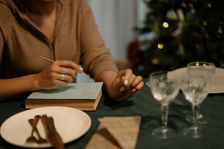 Woman Writing On A Card