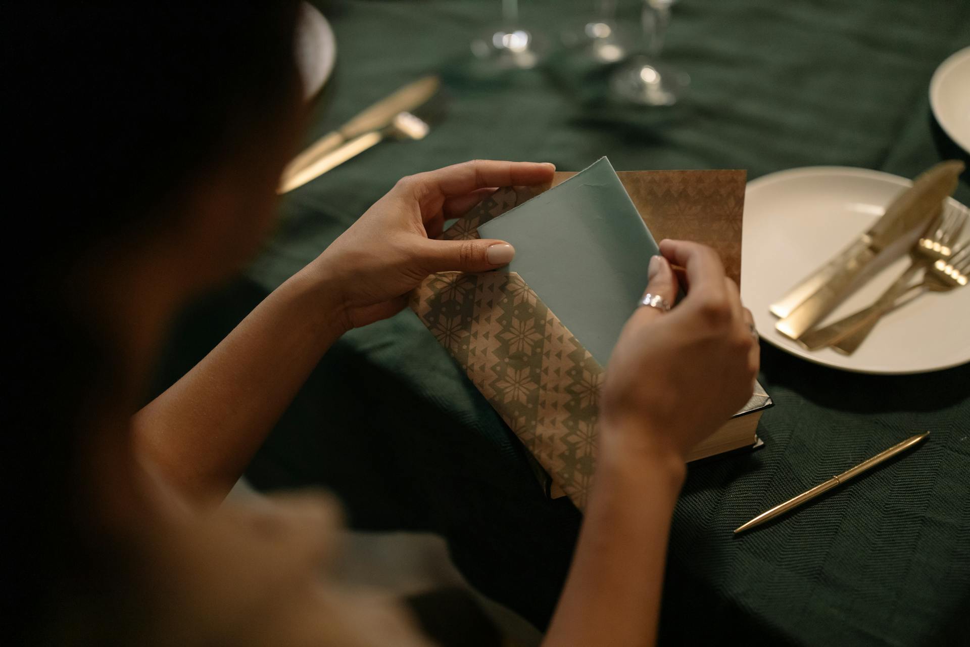 Woman Putting a Letter on an Envelope