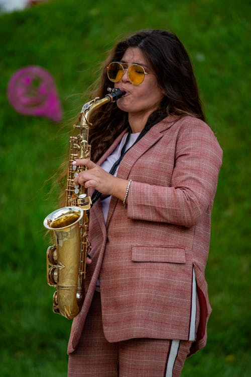 Close-Up Shot of a Woman Playing Saxophone 