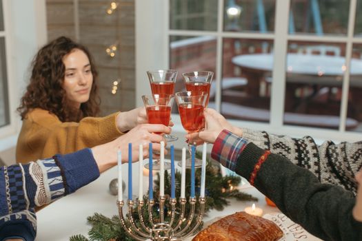 People Toasting Cordial Glasses with Red Liquid 