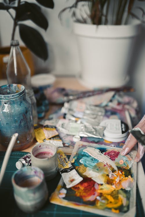 Paintbrushes and Paint Tubes on Table 