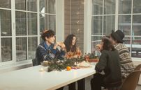 Friends Having a Conversation while Having Dinner Together