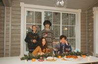 Group of People Sitting on Chair in Front of Table