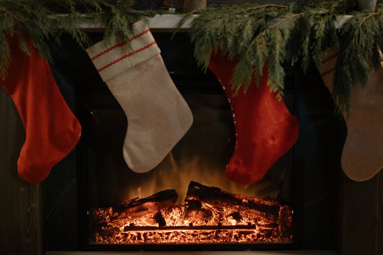 Christmas Socks Hanging At A Fireplace