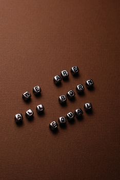Silver Beads on Brown Surface
