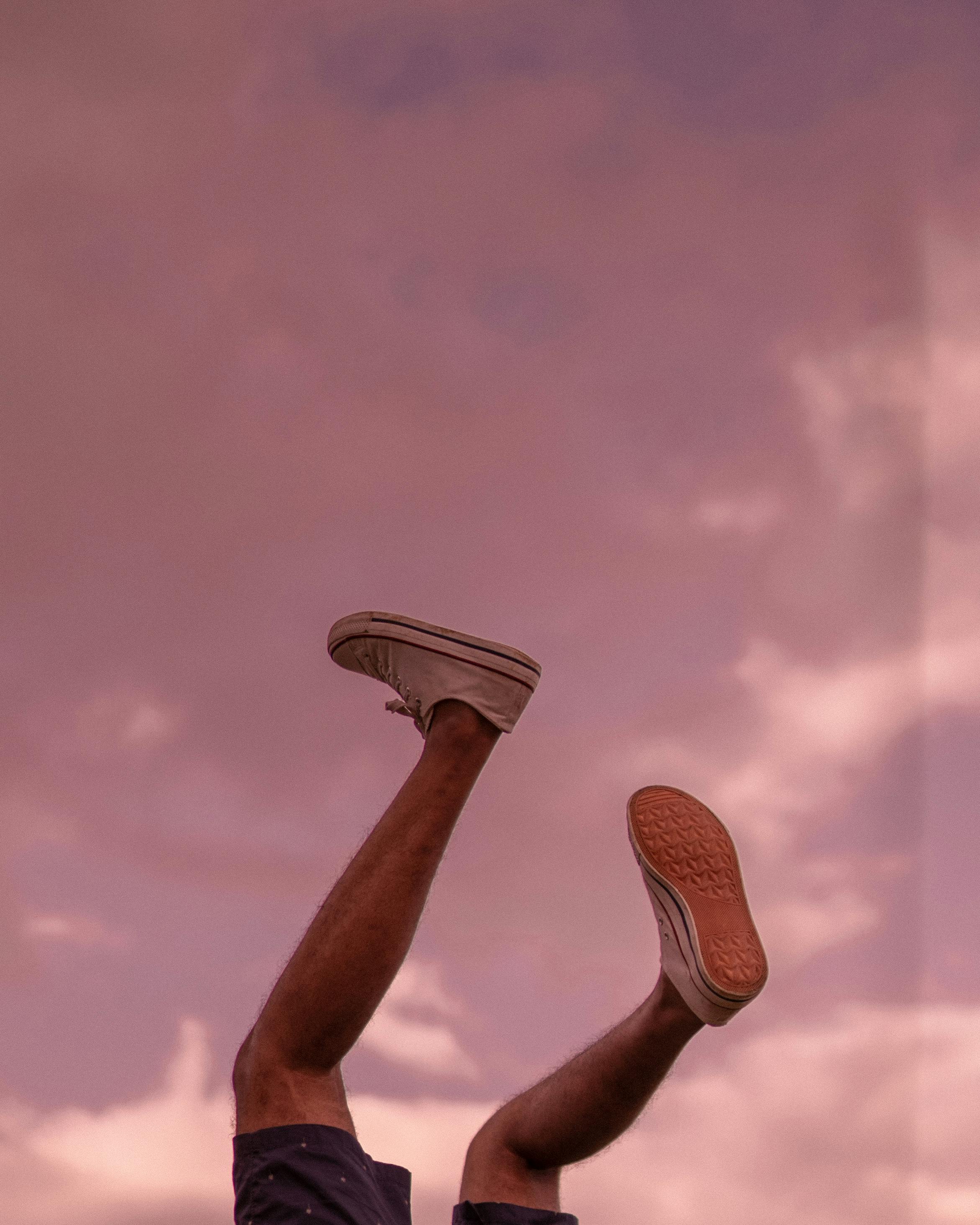 person wearing brown shoes jumping