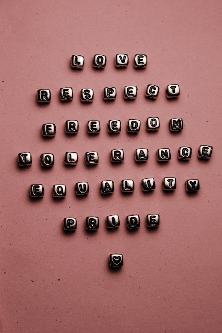 Beads With Letters On Pink Surface