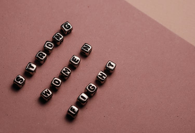 
A Close-Up Shot Of Silver Letter Beads