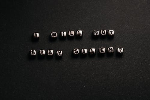 Free Black and White Shot of Beads with Letters Stock Photo