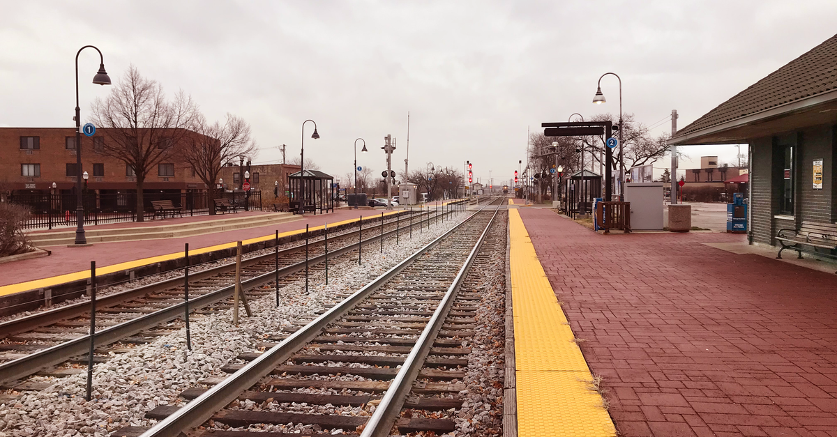 Empty train tracks at Bensenville station, showcasing transportation infrastructure.