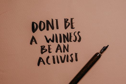 A Close-Up Shot of a Handwritten Quote beside a Fountain Pen