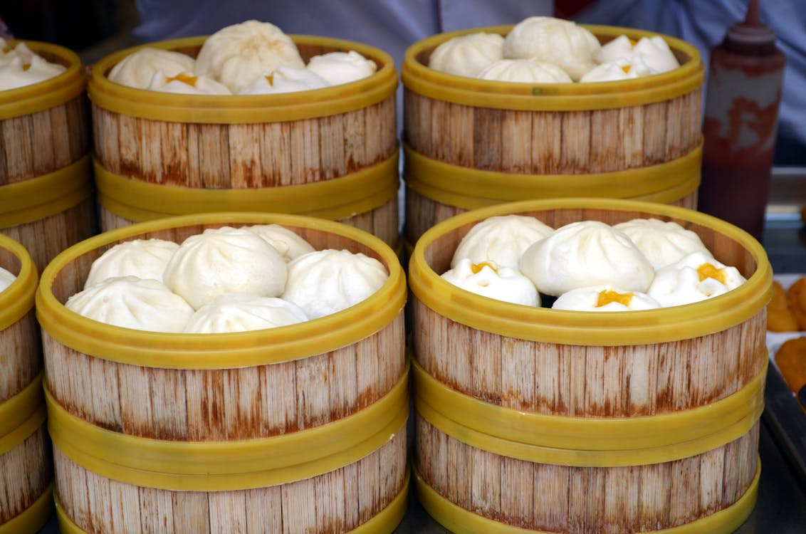 Free Photo of Steamed Buns on Wooden Barrels Stock Photo