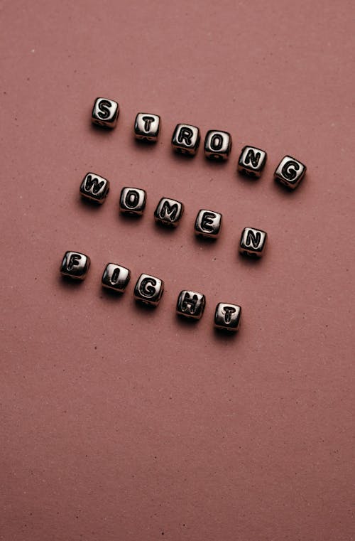Free Letters of Strong Women Fight on Beads Stock Photo