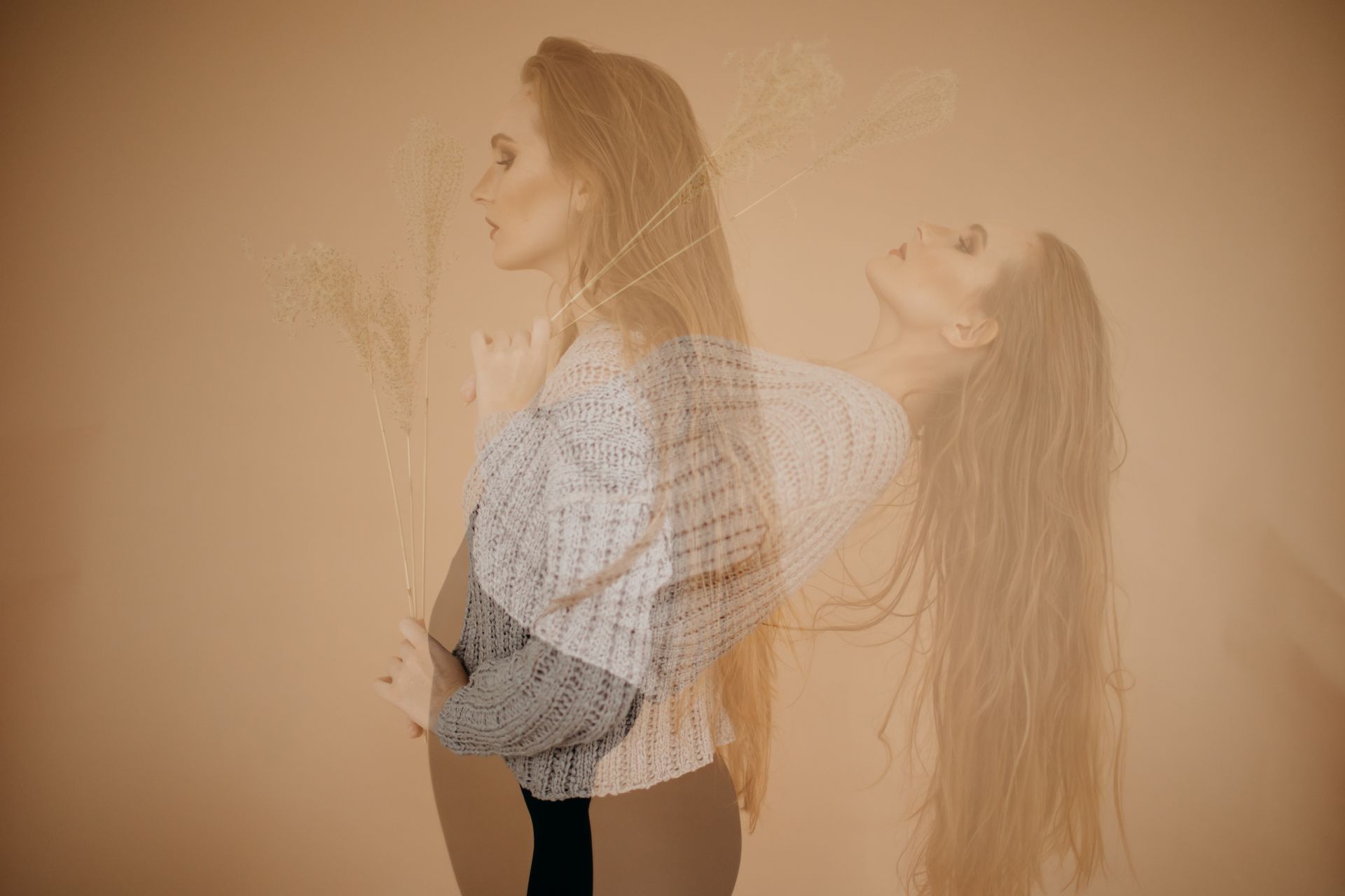 Creative double exposure of a woman posing in a studio with graceful elegance.