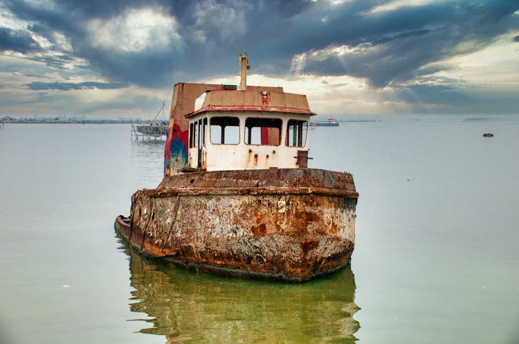 Abandoned Ship Moored In Sea