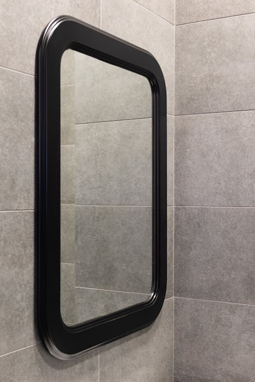 Mirror on wall in light bathroom