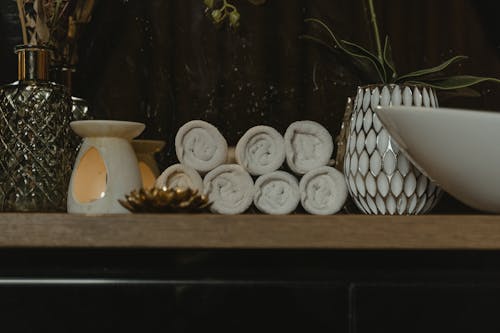 Rolled Towels on the Wooden Table