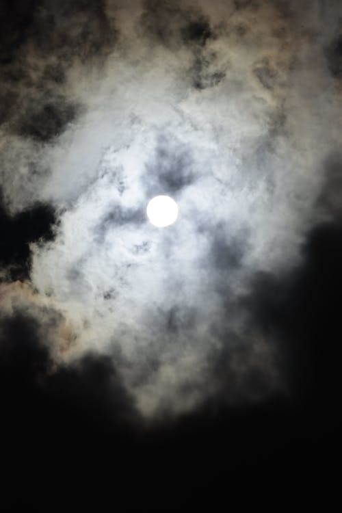 Moon shining in dark sky