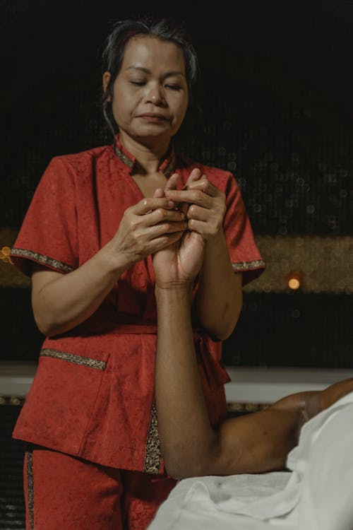 A Masseuse Doing a Massage