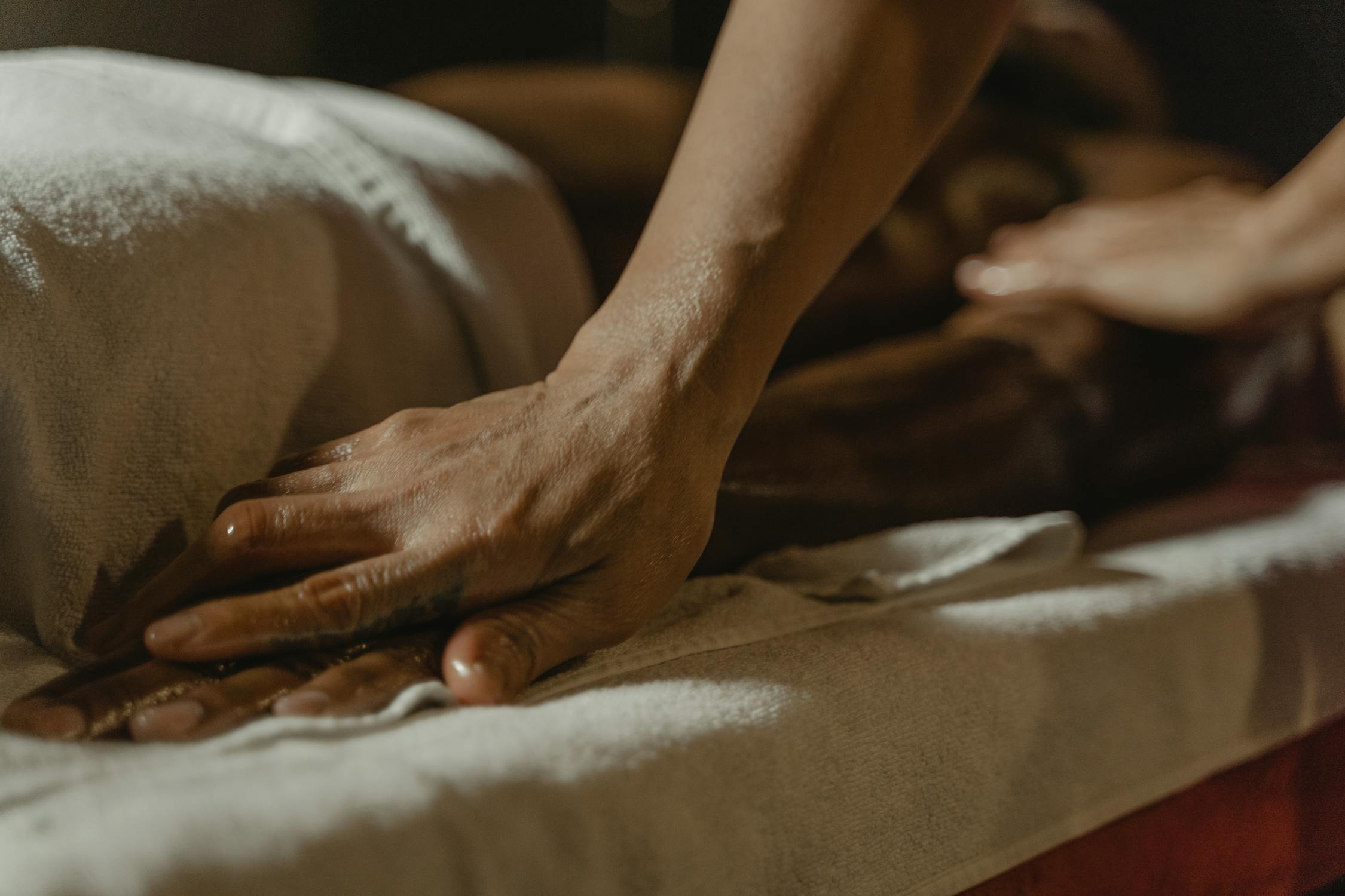 Man getting a massage in a hotel room. 