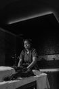 Grayscale Photo of a Masseuse Doing a Massage