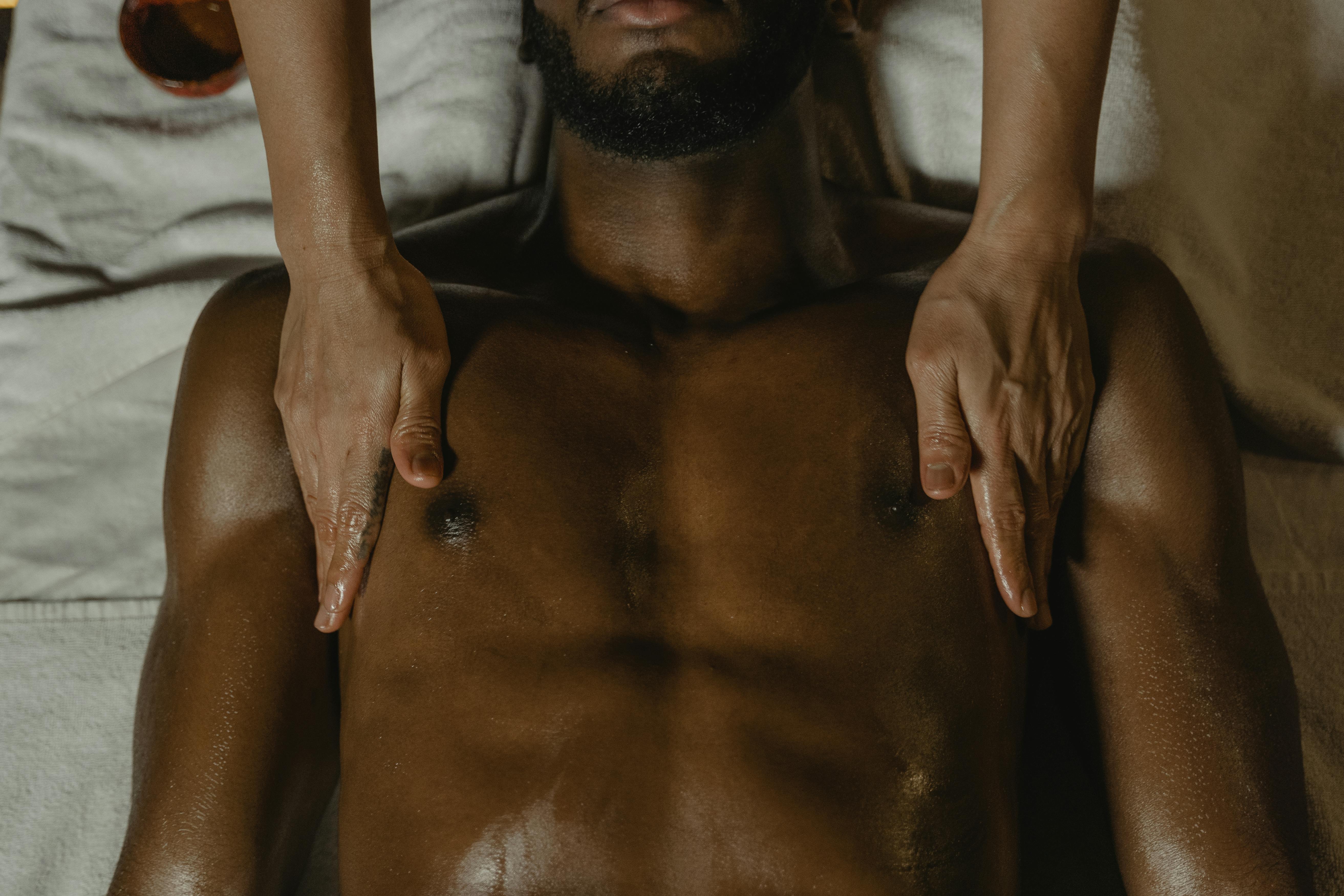 hands massaging male body