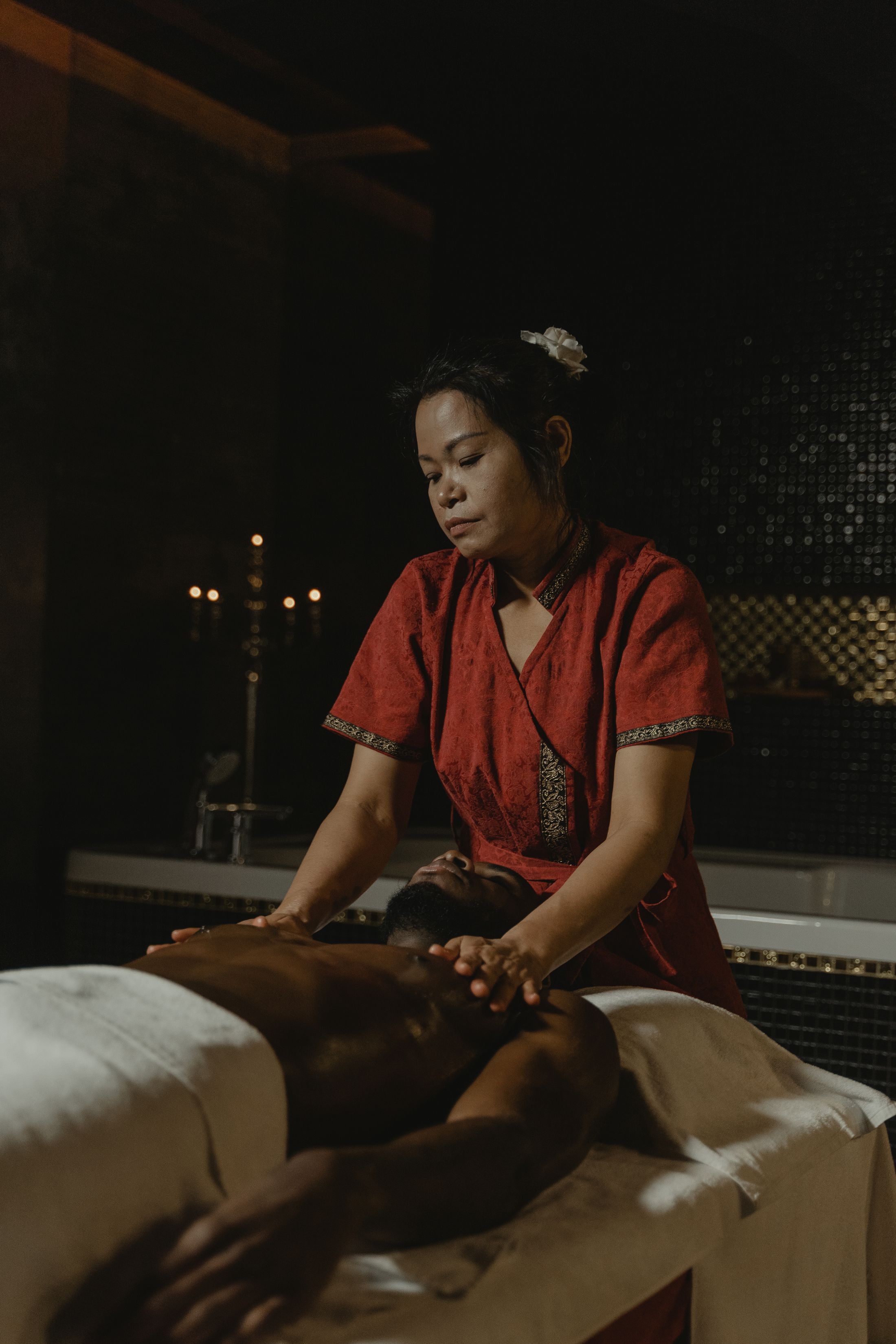 Warm candlelit massage treatment room