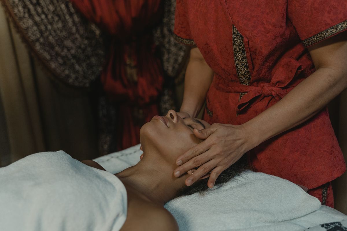 Therapist performing a sculpting facial massage
